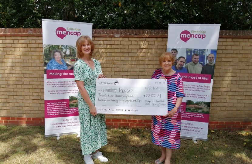 Mary Sheldon presents a cheque to Paula Walsh of Elmbridge Mencap